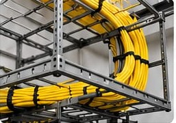 Yellow cables routed through overhead cable tray